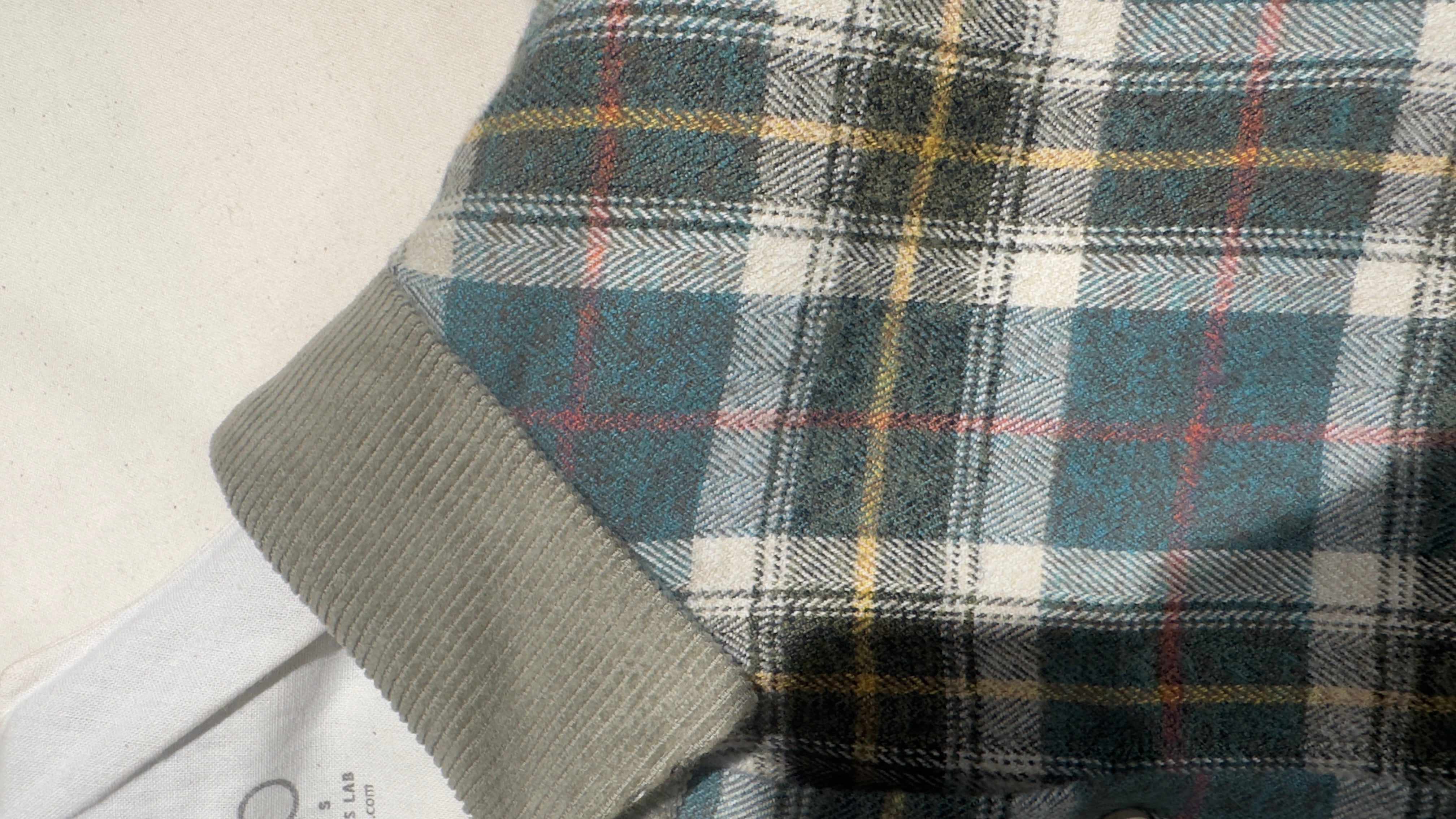 Asymetric check shirt with patch detail